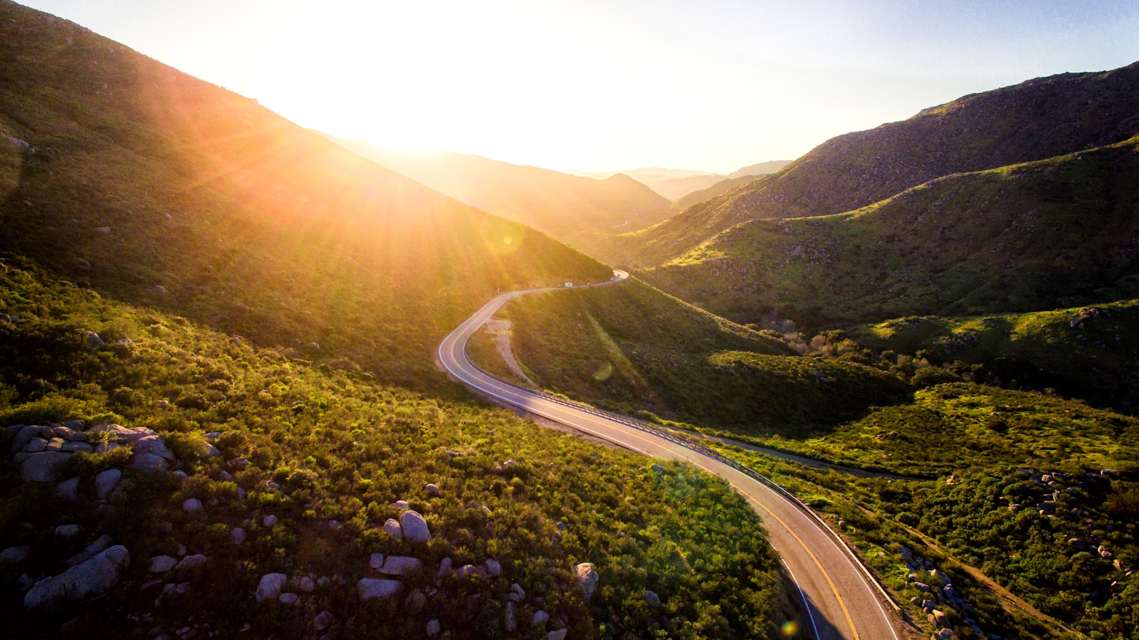 mountain pass during sunrise begin your journey