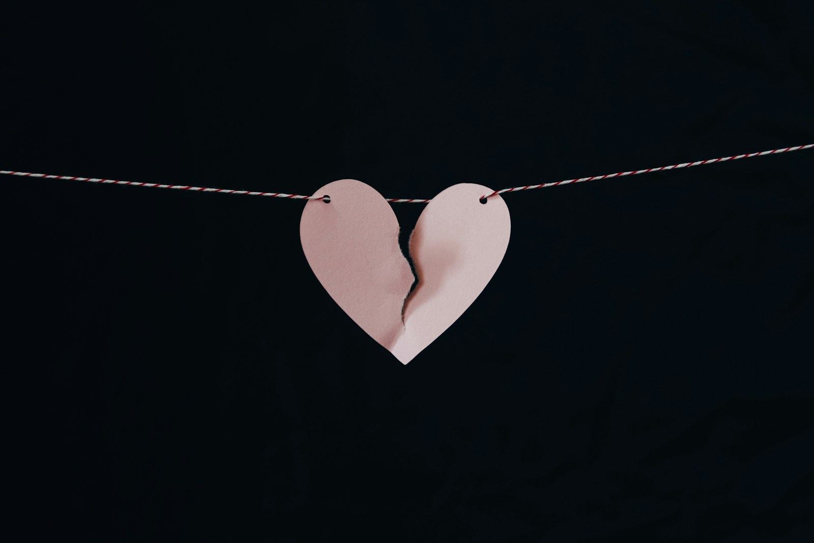 broken heart hanging on wire services